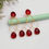 Thumbnail: Red gemstone earrings with gold hoops