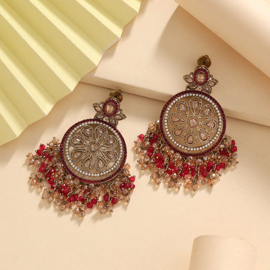 Elegant American diamond earrings with intricate detailing and maroon beads