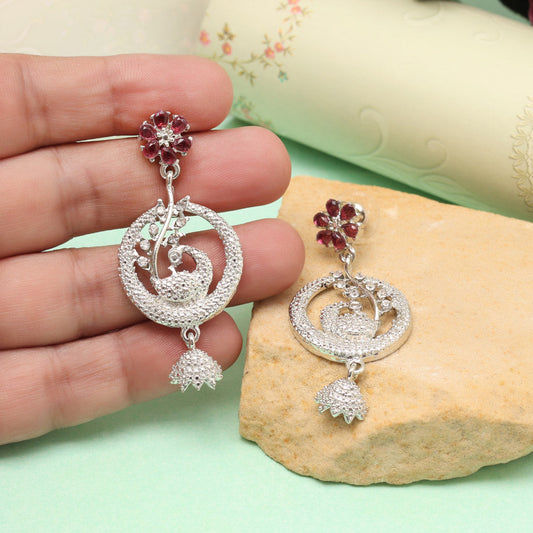 Elegant peacock earrings with red floral accents