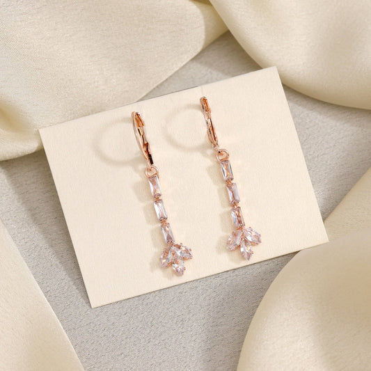 Rose gold earrings with baguette-cut stones