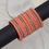 Thumbnail: Elegant coral bangles with ornate detailing
