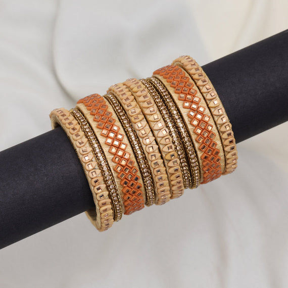 Elegant beige and orange bangles