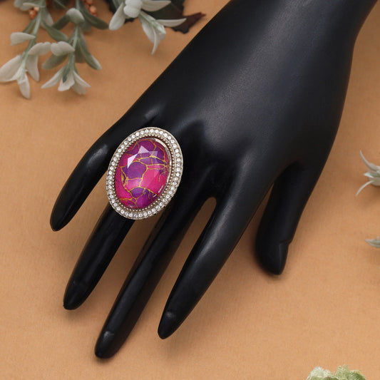 Oval pink ring with diamond accents