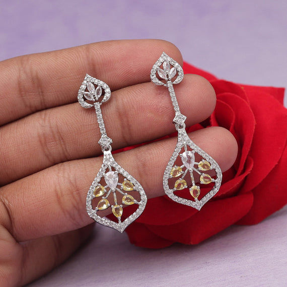 Elegant silver earrings with yellow and white stones