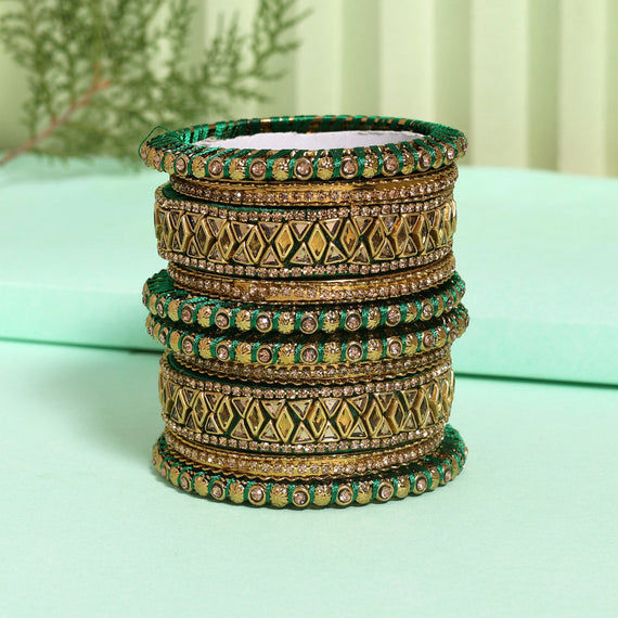 Green and gold bangles with intricate details