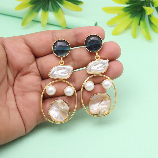 Elegant gold earrings with pearls and blue stones