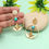 Thumbnail: Gold earrings with turquoise stones and leaf accents