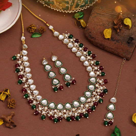Elegant pearl necklace set with green and red accents
