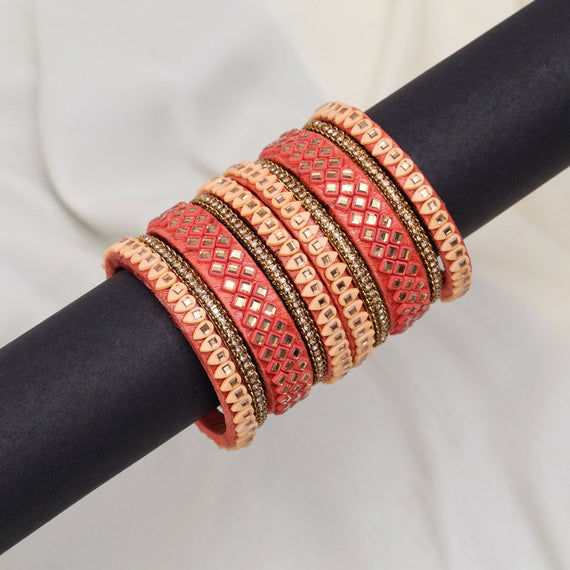 Peach and gold bangles
