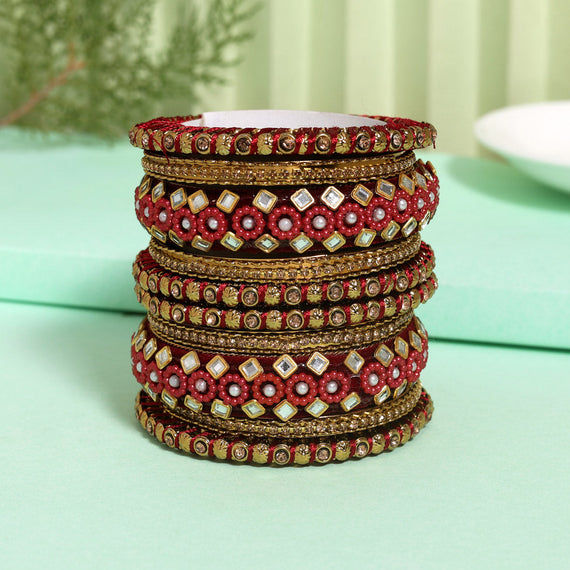 Red and gold bangles with intricate detailing