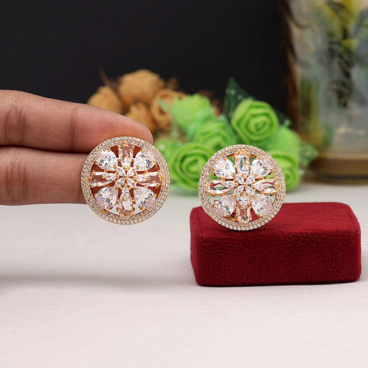 Elegant gold earrings with white stones