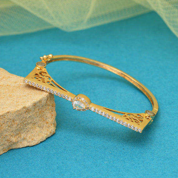 Elegant gold bangle with clear stones