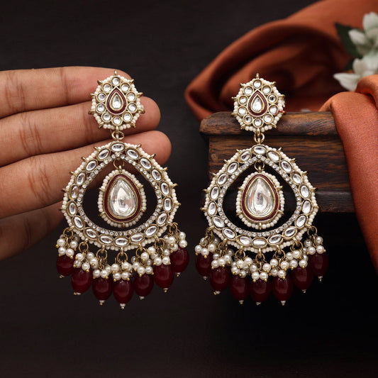 Elegant Kundan earrings with maroon beads