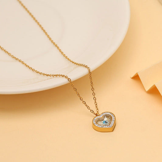 Gold heart necklace with light blue stone