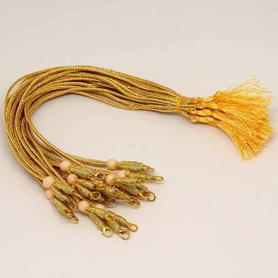 Gold cords with beads and tassels