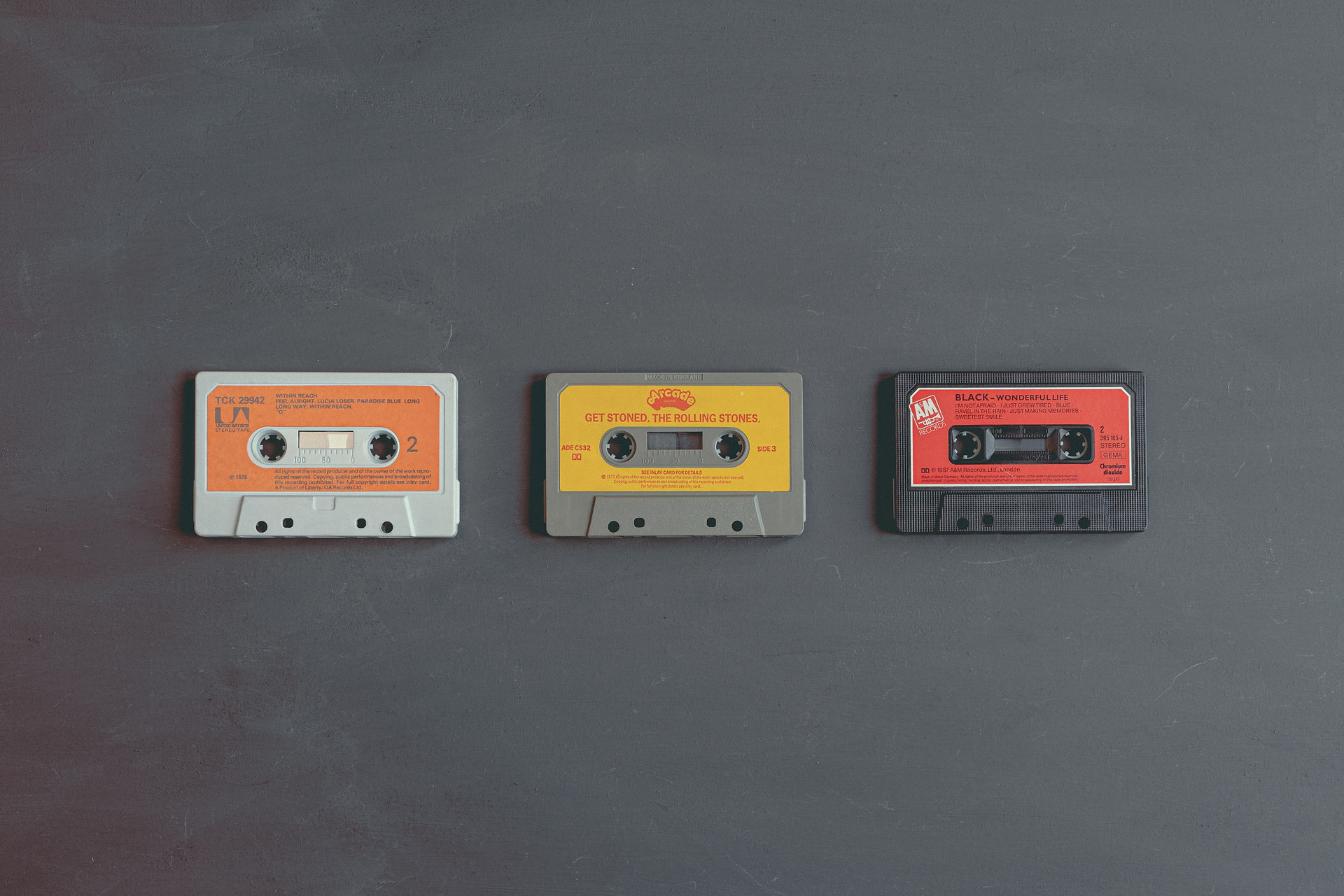 3 colourful retro cassettes