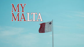 Malta flag against a clear blue sky