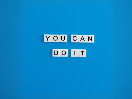 White letter tiles spelling ‘YOU CAN DO IT’ on a bold blue background