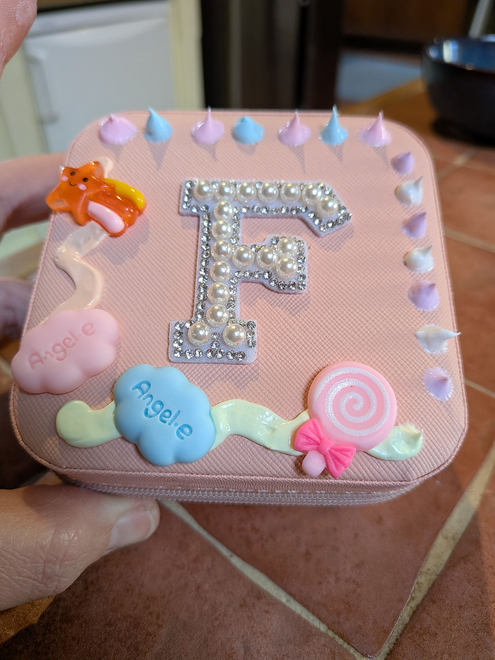 Thumbnail: Close up of mini jewellery box with the letter 'F' to personalise it, sweet charms and decoden cream glue to look like icing.