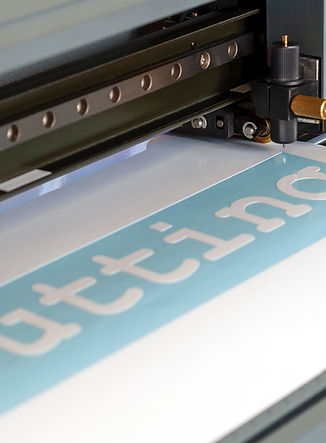 Cutting plotter close-up. The process of cutting a vinyl film..jpg