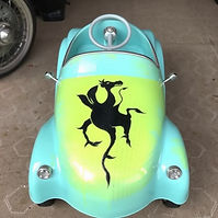 spray paint stencil on pedal car.jpg