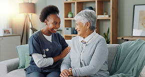 happy-face-nurse-elderly-patient-nursing-home-healthcare-volunteer-with-charity-sofa-clinic-caregiver-portrait-embrace-senior-lady-with-trust-medical-support-couch