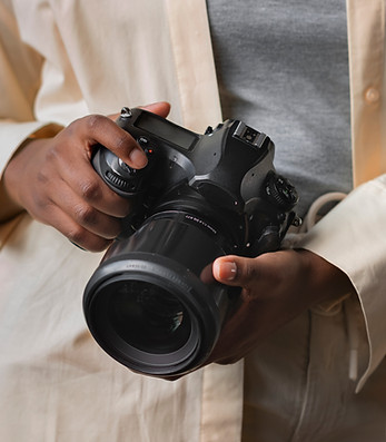 front-view-woman-holding-photo-camera 2.jpg