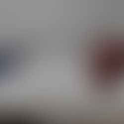 HD Cleaning Airbnb clean in Hounslow: guest-ready bedroom with crisp white linen, navy bed runner, folded towels and rust cushions.