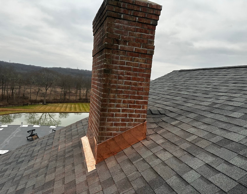 Chimney flashing and brick masonry repair on a Garfield NJ roof