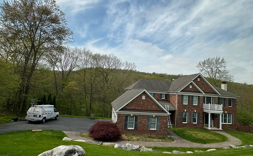 Crew checking the exterior openings of a Bergen County home during a window assessment