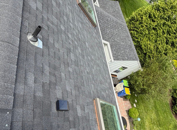 Completed roof replacement with new ridge vent on an NJ home