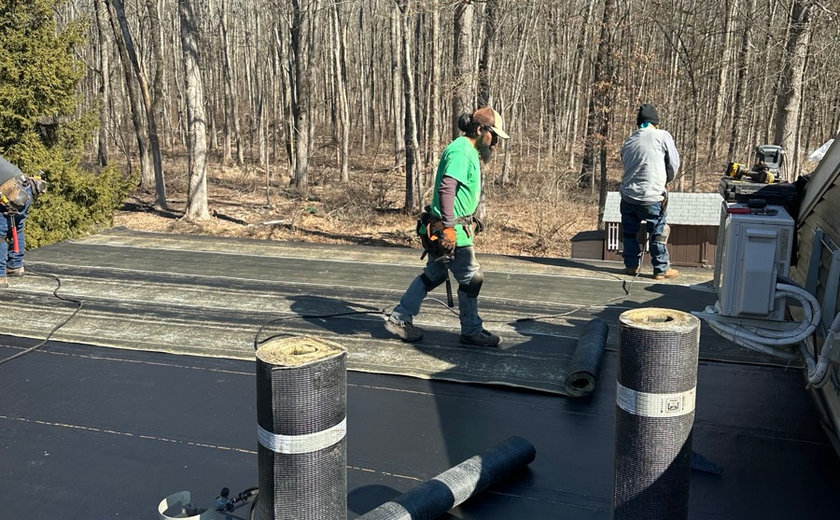 Flat roof repair on a Nutley NJ home by Four Seasons Roofing and Construction