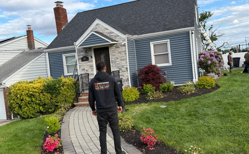 Masonry crew repointing brick joints on a Totowa NJ house