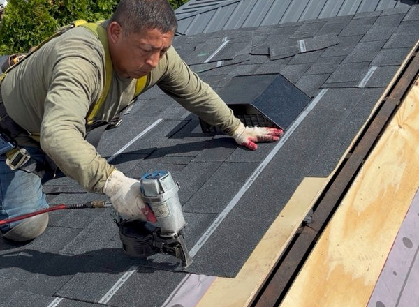 Roof repair in progress on a North Jersey home like those in Paramus