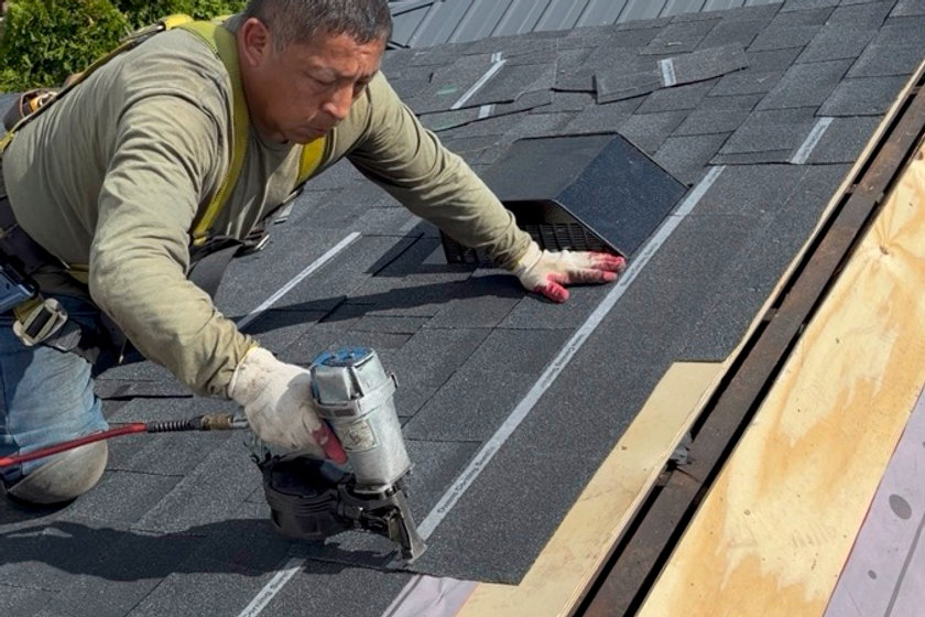 Tracing and repairing a roof leak on a Passaic NJ two-family home