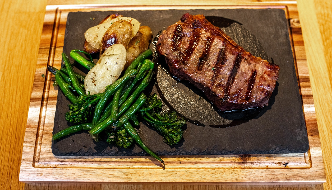 Grilled steak with potatoes and green beans at Bella Capri Fleet