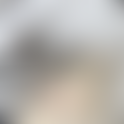 Stairwell access finished in light natural stone steps, with black metal handrails leading down from the terrace.