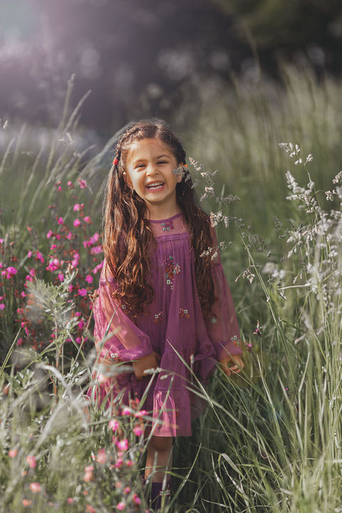 girl-wearing-purple-dress-in-wild-grass.jpg