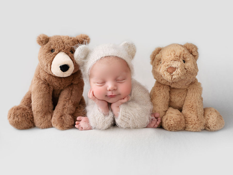 newborn with teddy bears during photo session in Leicestershire