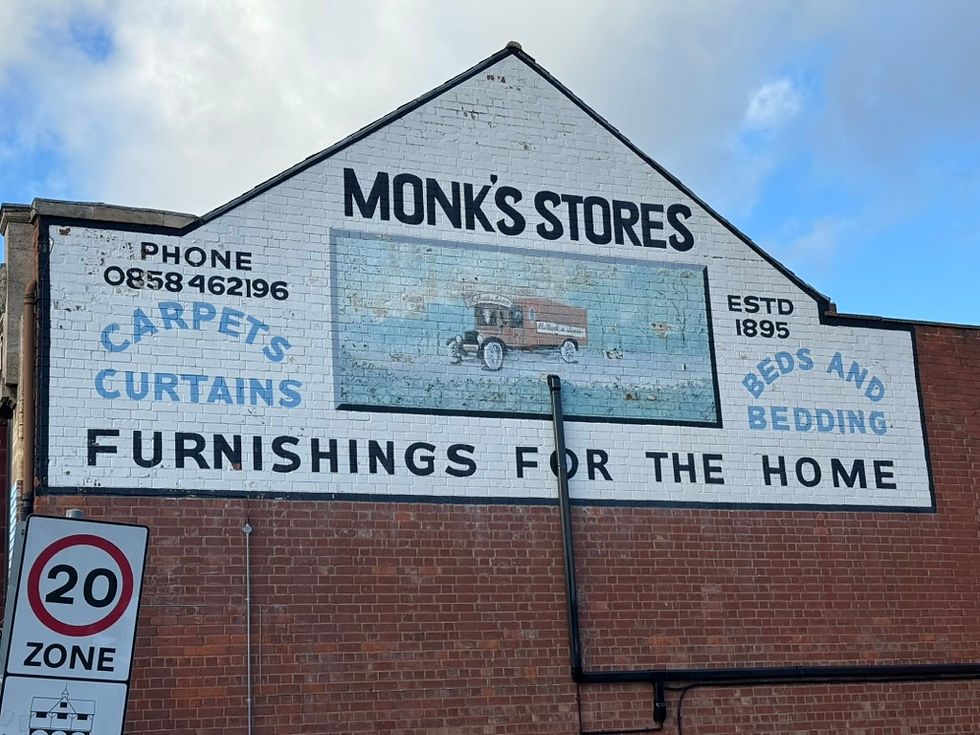 Monks Stores sign close up.jpeg