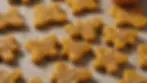 Close-up view of freshly baked pumpkin and oatmeal dog treats