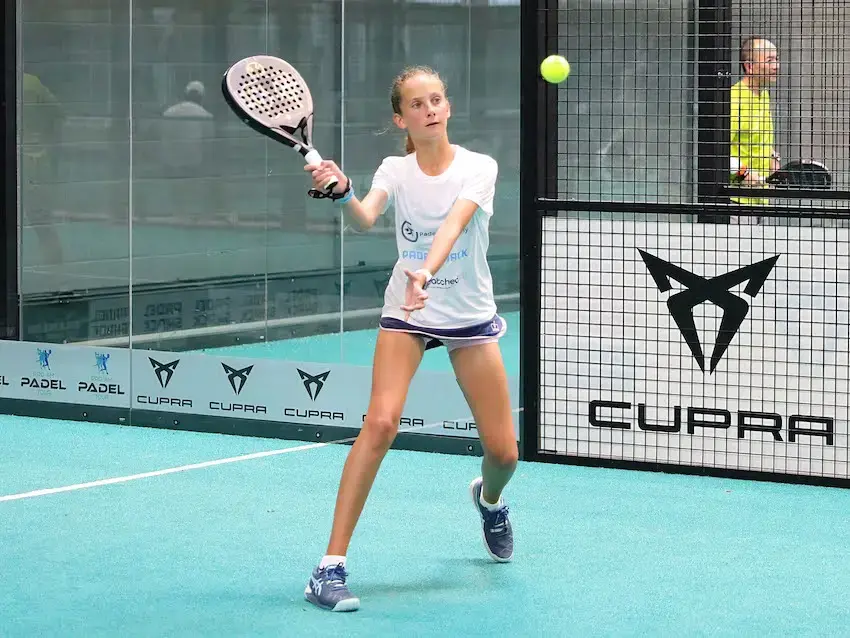 Action shot of Rosie Quirk on a padel court