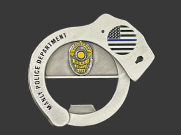 Manly Police cuff-shaped antique silver challenge coin bottle opener with police badge in color.