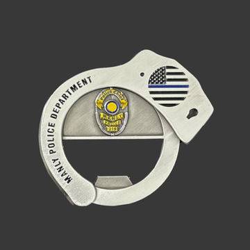 Manly Police cuff-shaped antique silver challenge coin bottle opener with police badge in color.
