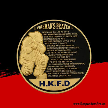 A round, bright gold challenge coin featuring a 3D depiction of a firefighter kneeling in prayer. Beside the firefighter, a poem is engraved.