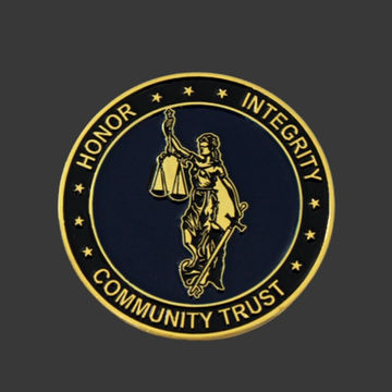 Clearwater Police Challenge Coin with blue background, gold Lady of Liberty, and bold gold text.