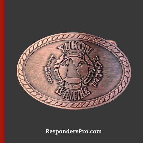 Oval antique bronze belt buckle featuring the Yukon First Nations Wildfire insignia in the center.