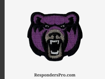 Embroidered mini patch of a bear mascot with intricate purple and grey stitching and detailed accents.