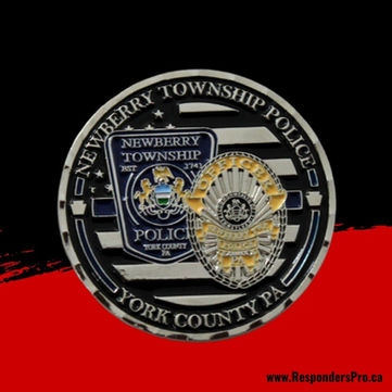Round police challenge coin featuring a gold and white police badge and shield emblem, set against a black and silver lined background.