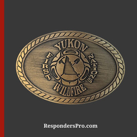 Oval antique gold belt buckle featuring the Yukon First Nations Wildfire insignia in the center.